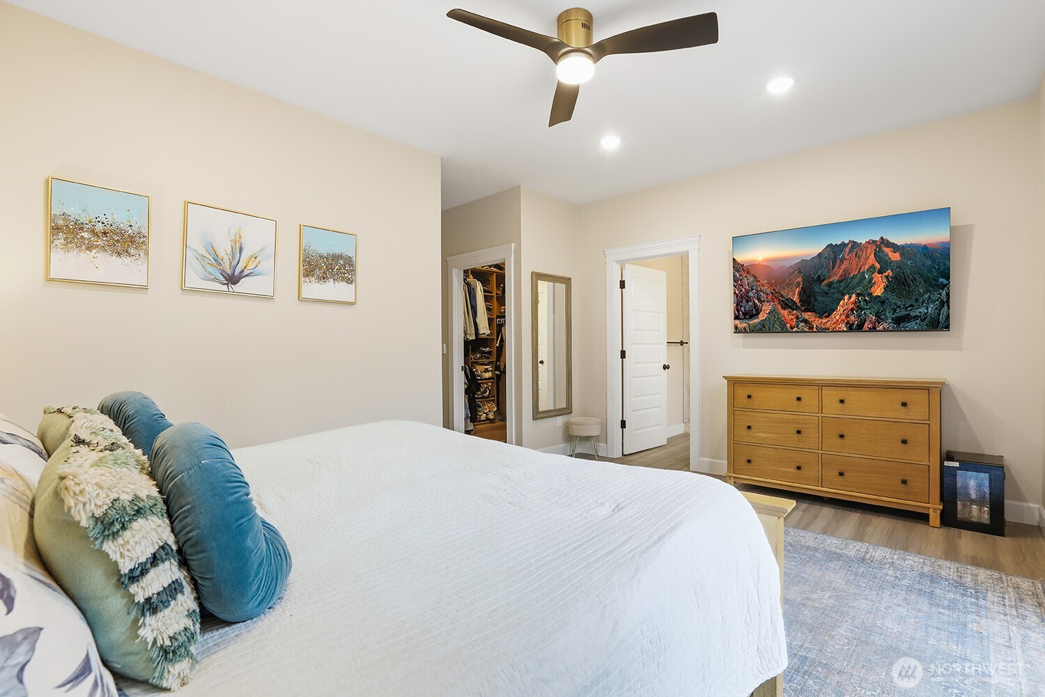 3237 Hilberg Lane Clinton, WA 98236 - Photo 16 of 40 a bedroom with a bed and a flat tv screen on dresser