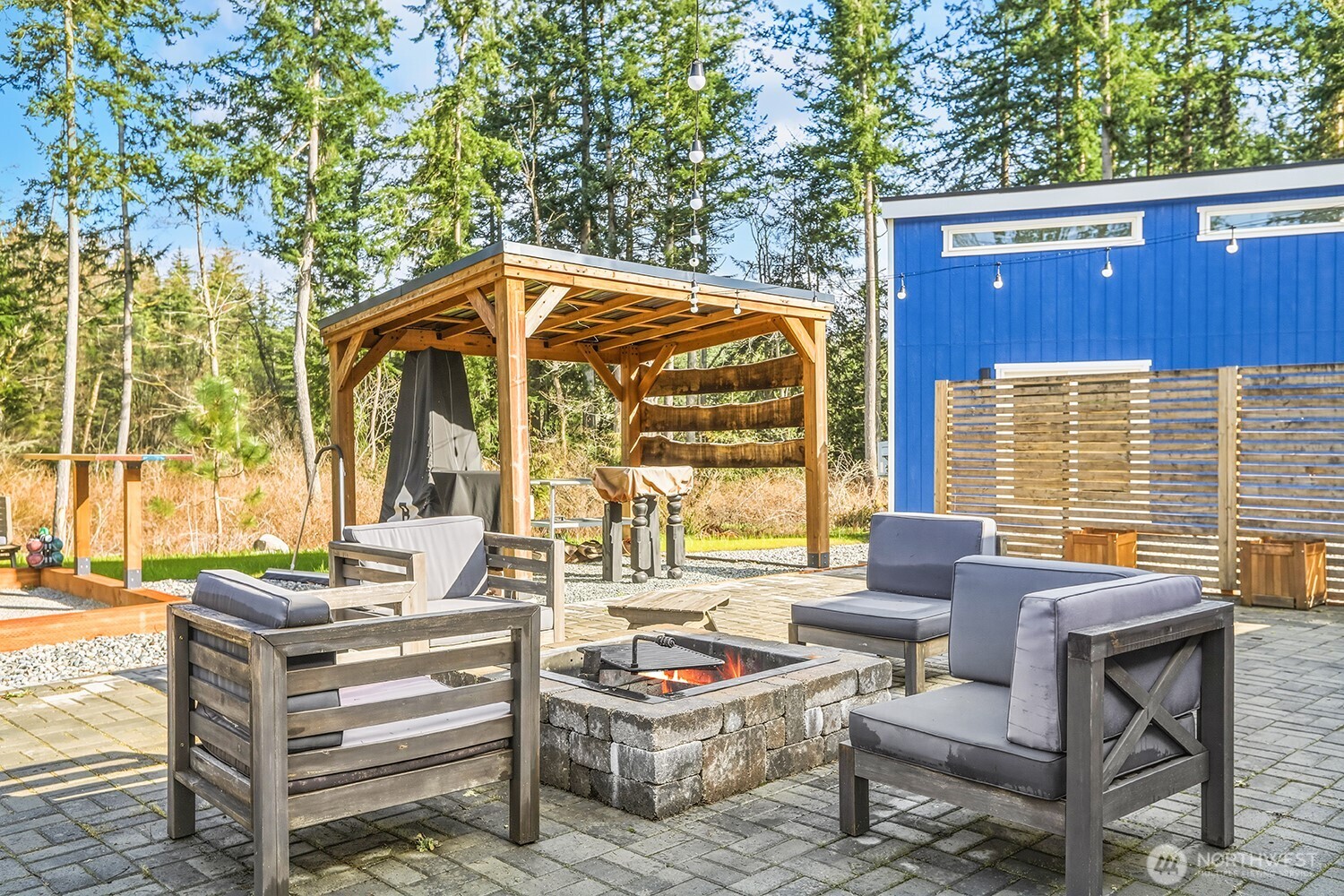 3237 Hilberg Lane Clinton, WA 98236 - Photo 21 of 40 a backyard of a house with outdoor seating