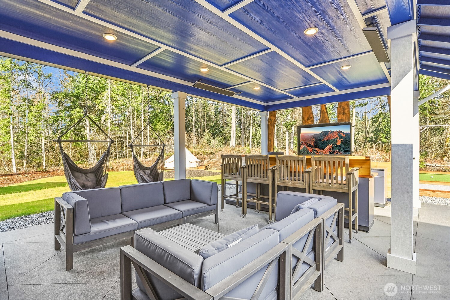 3237 Hilberg Lane Clinton, WA 98236 - Photo 22 of 40 a living room with furniture and a floor to ceiling window