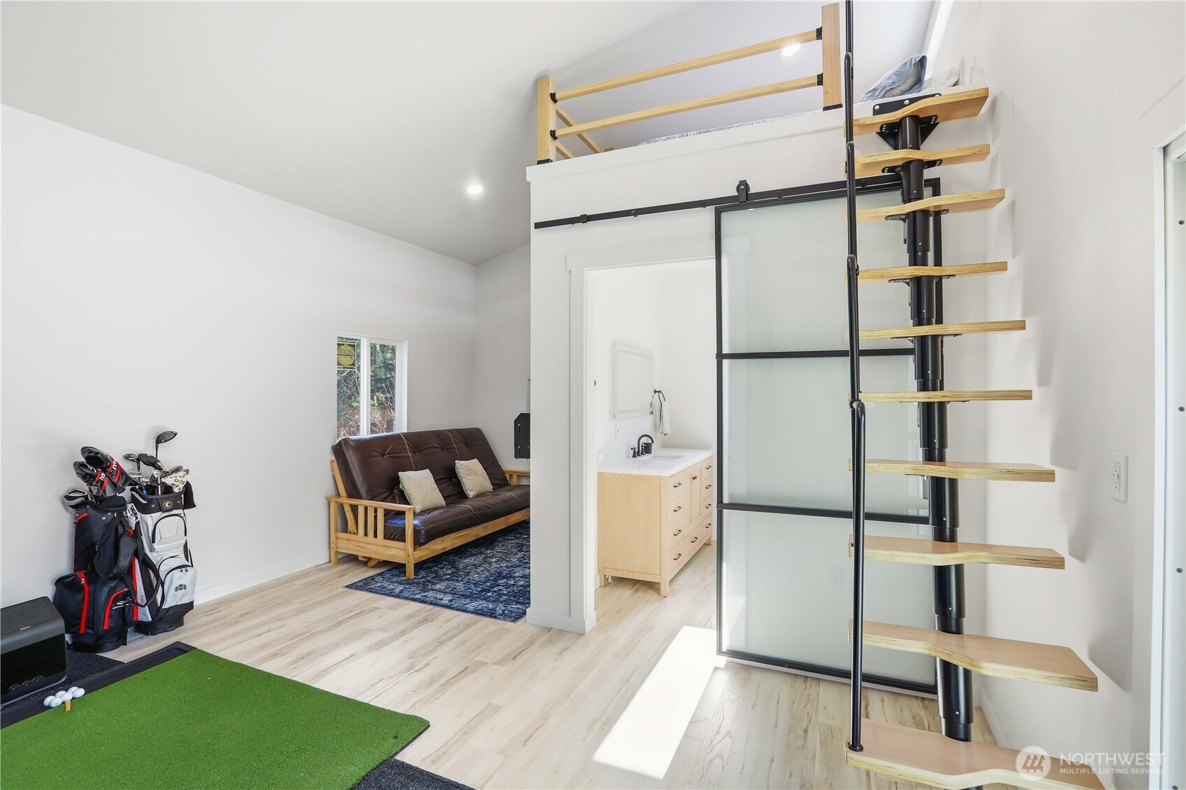 3237 Hilberg Lane Clinton, WA 98236 - Photo 24 of 40 a view of living room with furniture and wooden floor