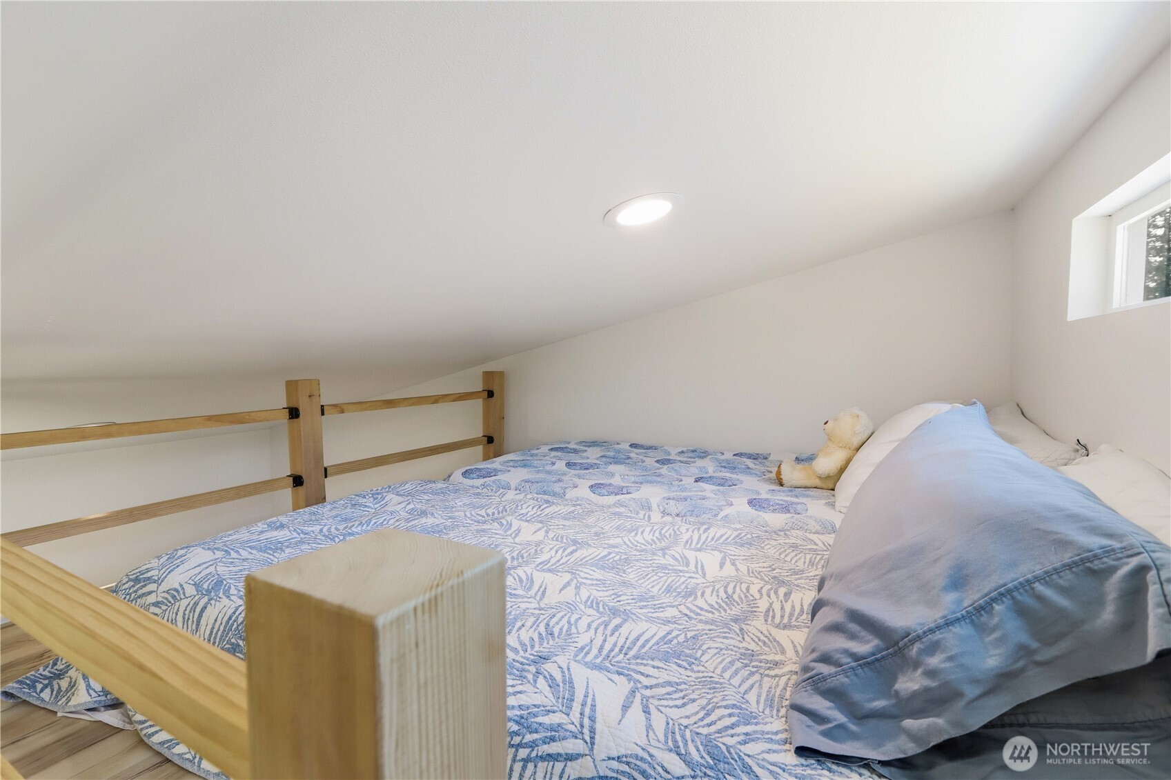 3237 Hilberg Lane Clinton, WA 98236 - Photo 26 of 40 a bedroom with a bed and a window