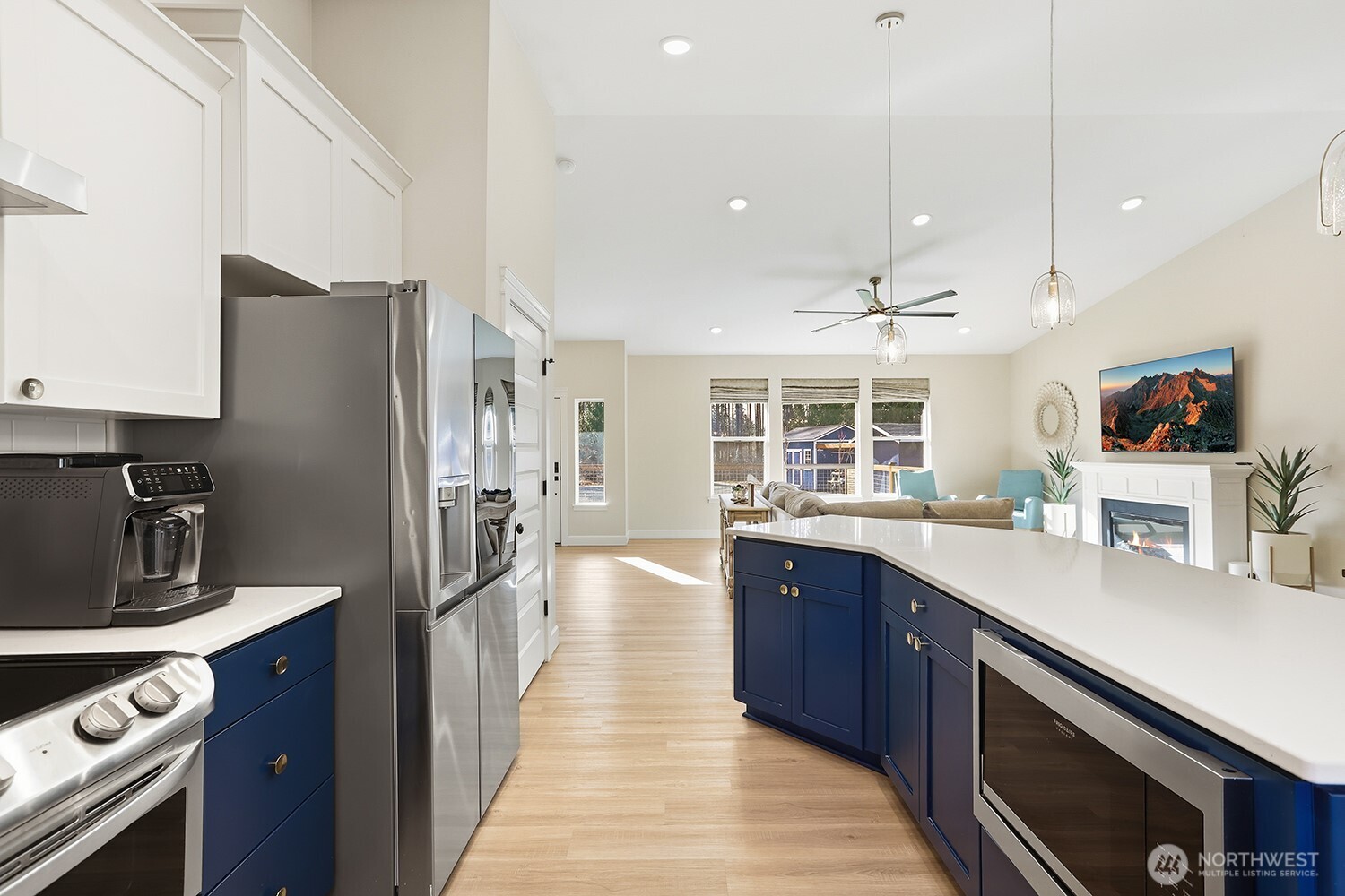 3237 Hilberg Lane Clinton, WA 98236 - Photo 8 of 40 a kitchen with stainless steel appliances granite countertop a sink a stove and a refrigerator