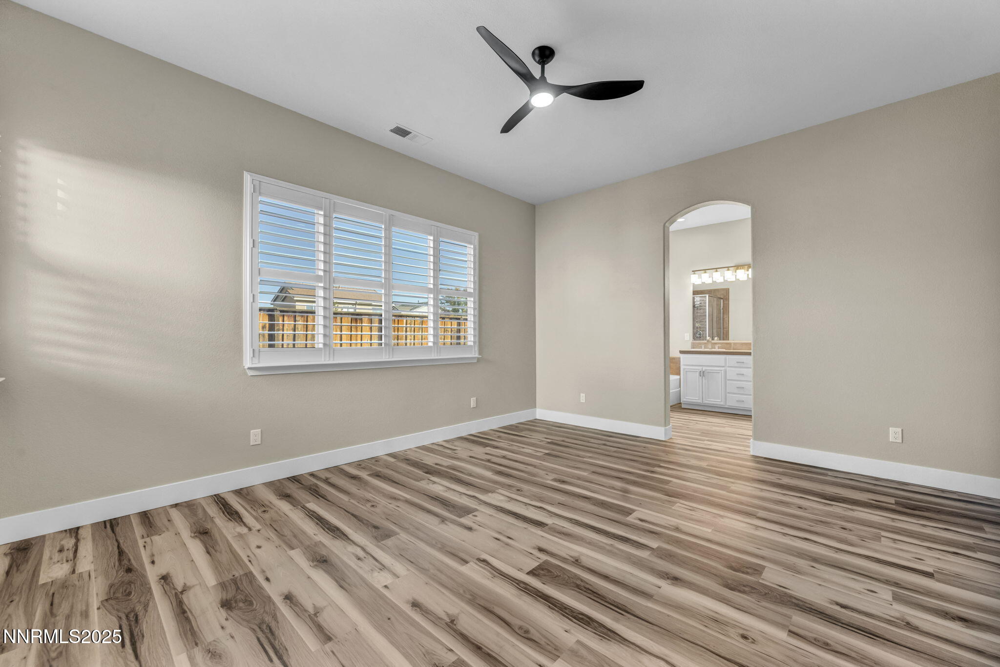 1781 Emerald Bay Drive Reno, NV 89521 - Photo 13 of 42 a view of empty room with wooden floor and fan
