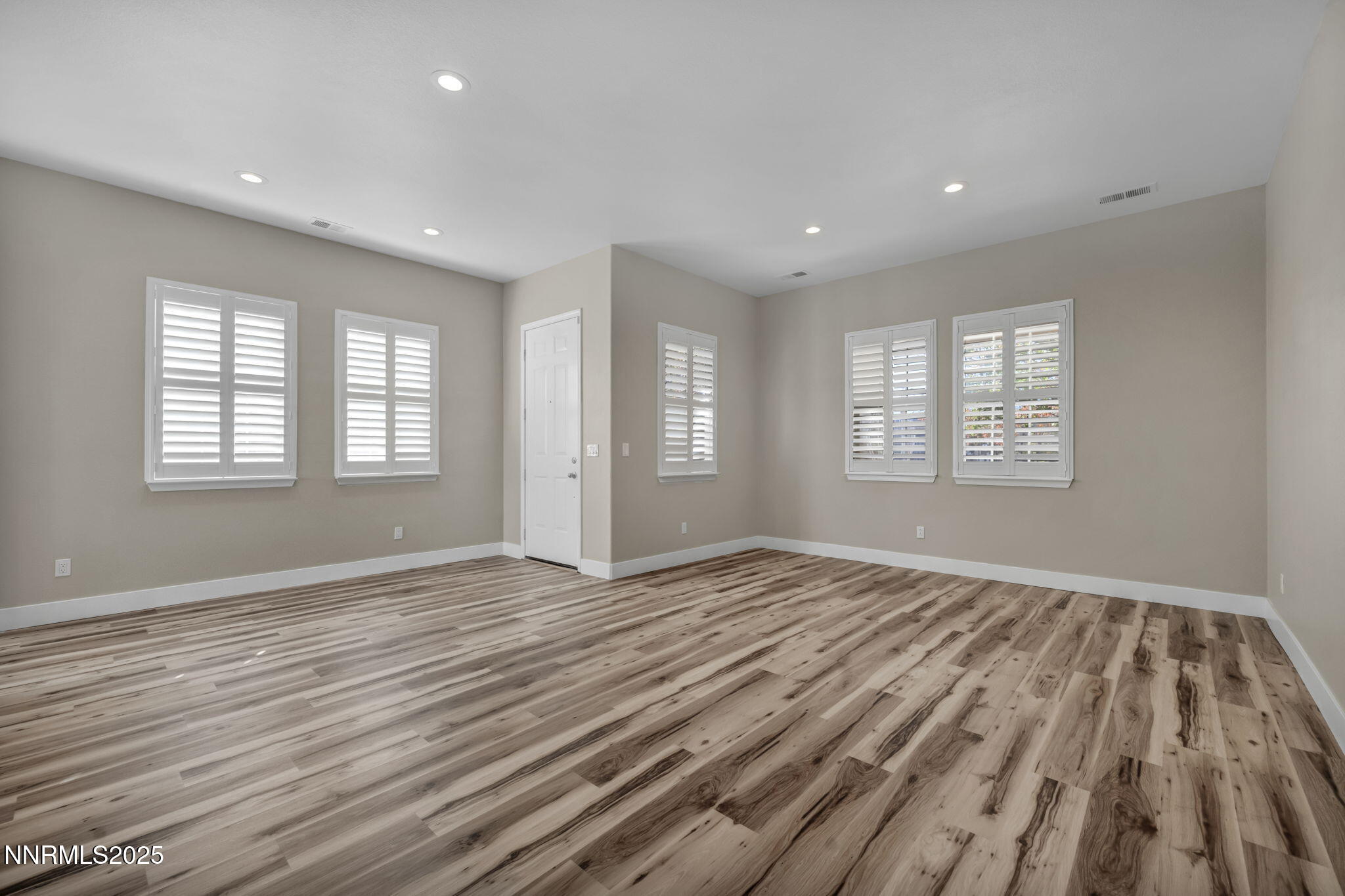 1781 Emerald Bay Drive Reno, NV 89521 - Photo 21 of 42 a view of an empty room with wooden floor and window