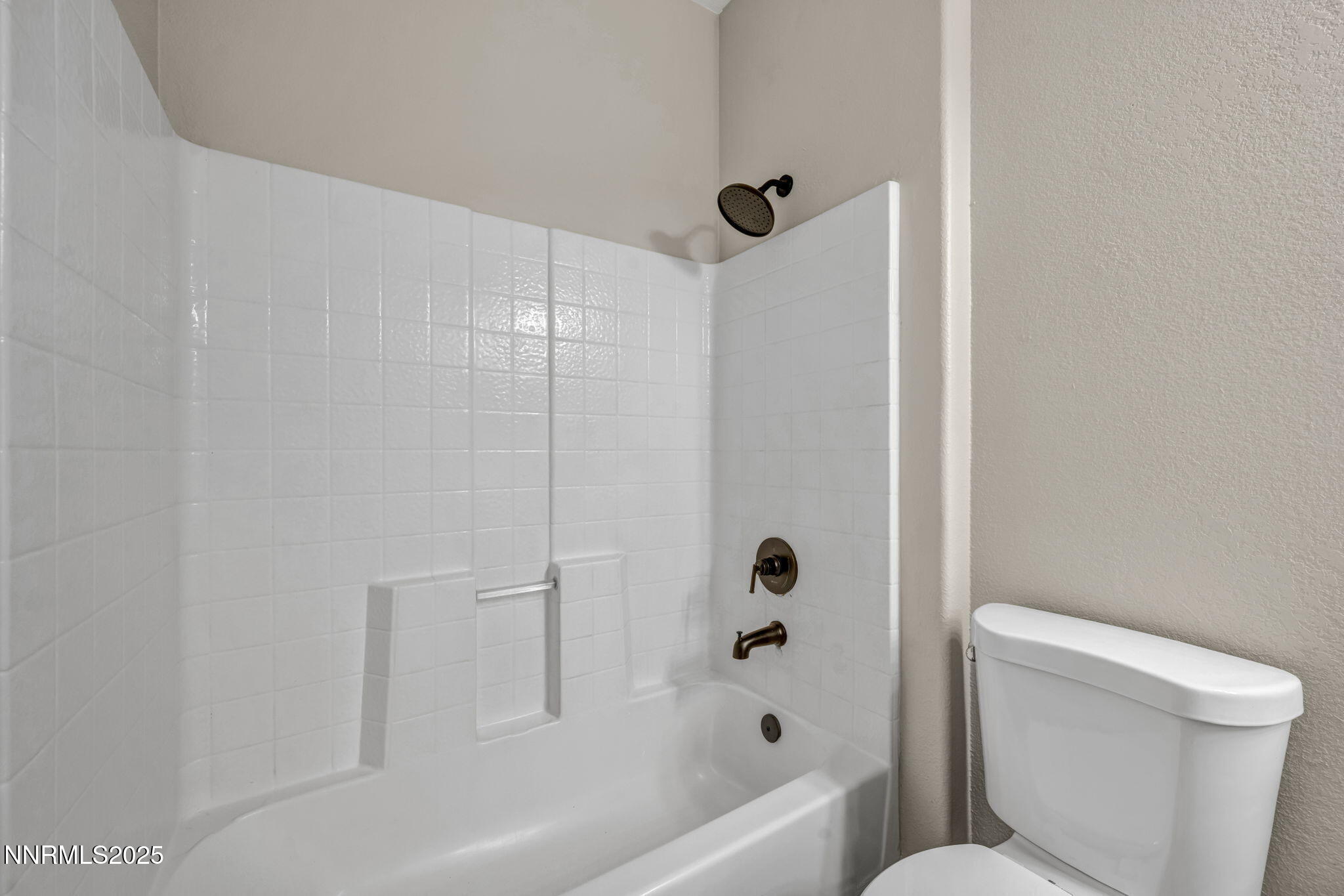1781 Emerald Bay Drive Reno, NV 89521 - Photo 25 of 42 a bathroom with a toilet and a bathtub