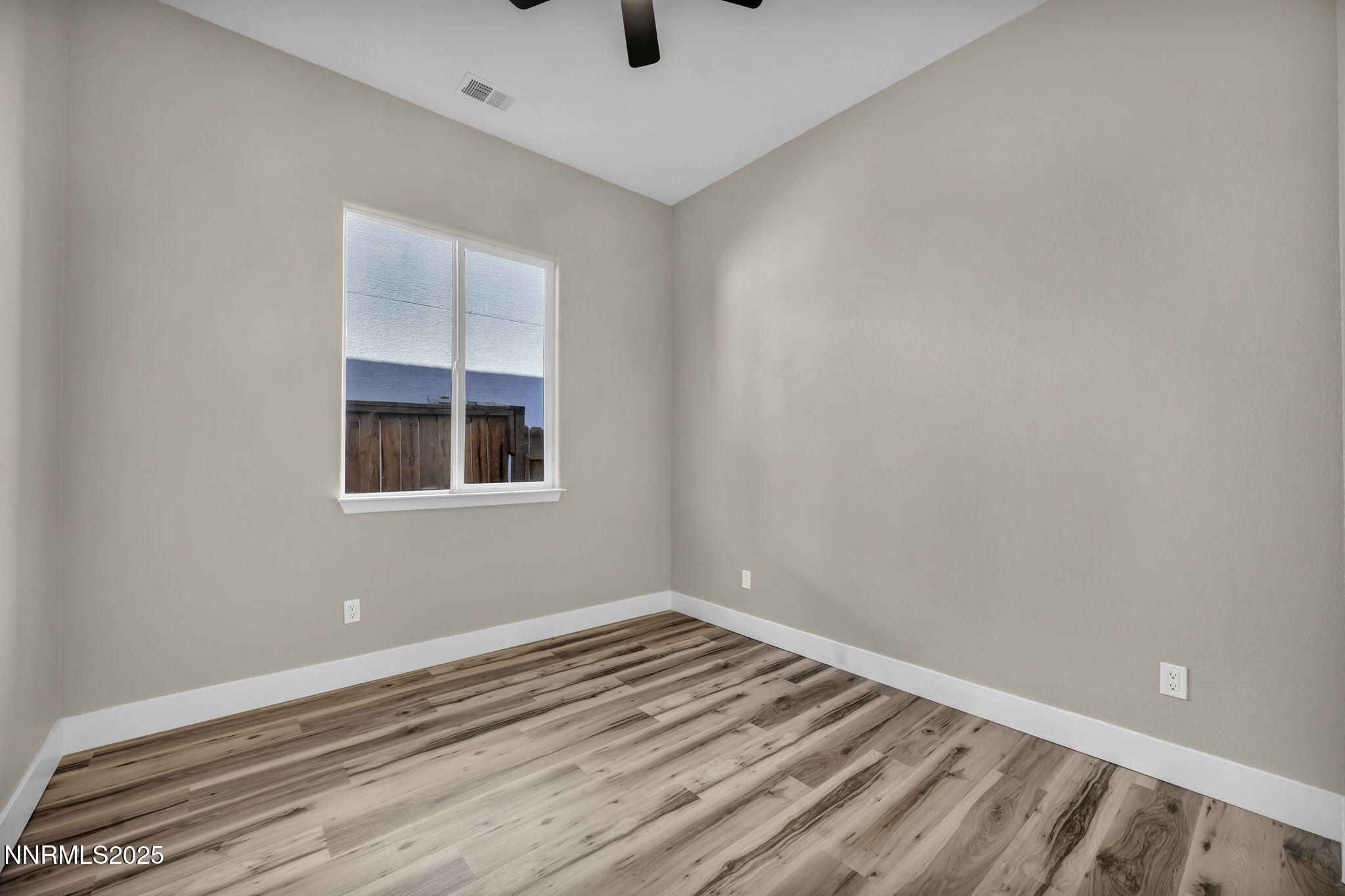 1781 Emerald Bay Drive Reno, NV 89521 - Photo 28 of 42 a view of empty room with window and ceiling fan
