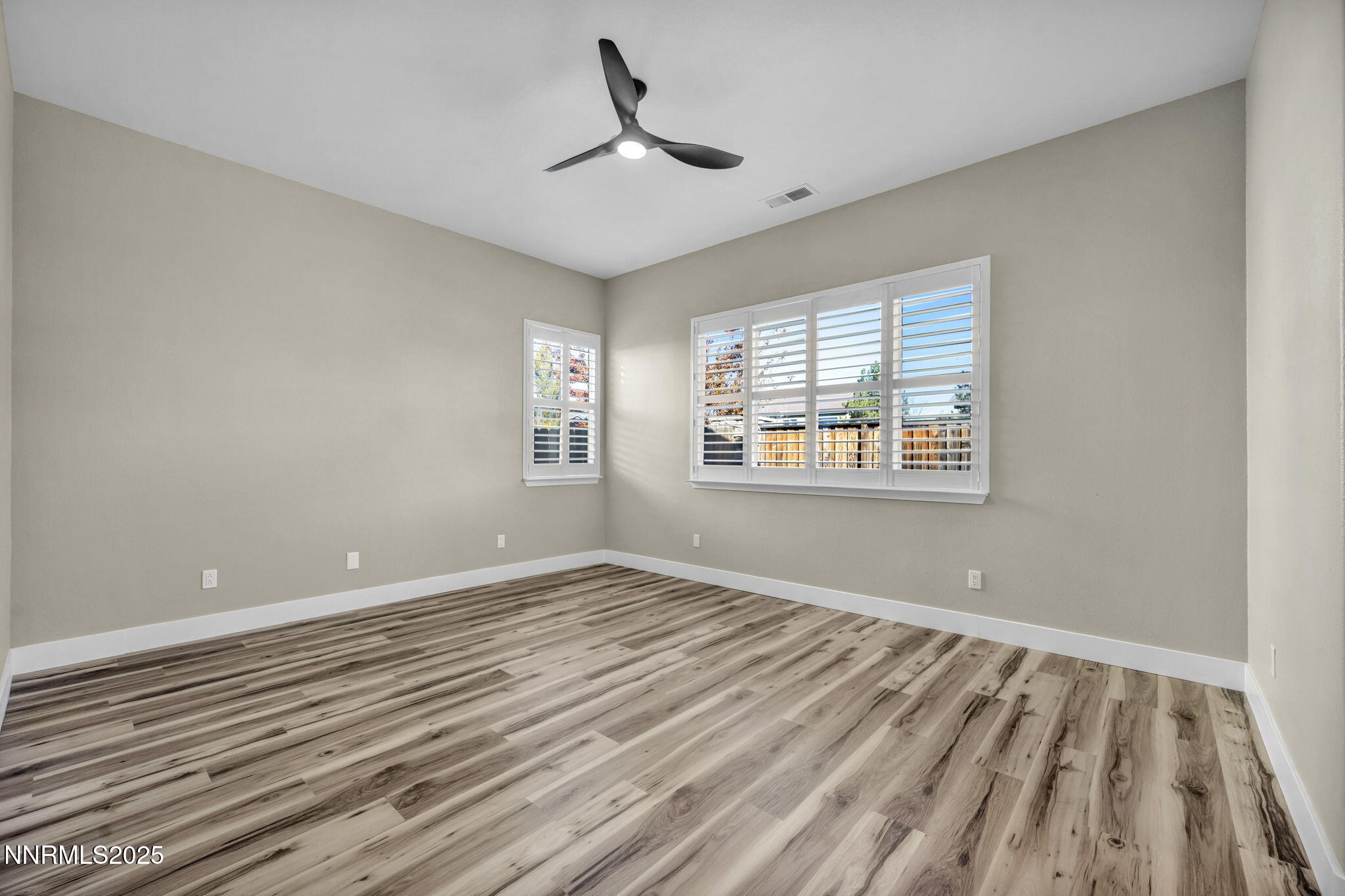 1781 Emerald Bay Drive Reno, NV 89521 - Photo 30 of 42 a view of empty room with wooden floor and fan