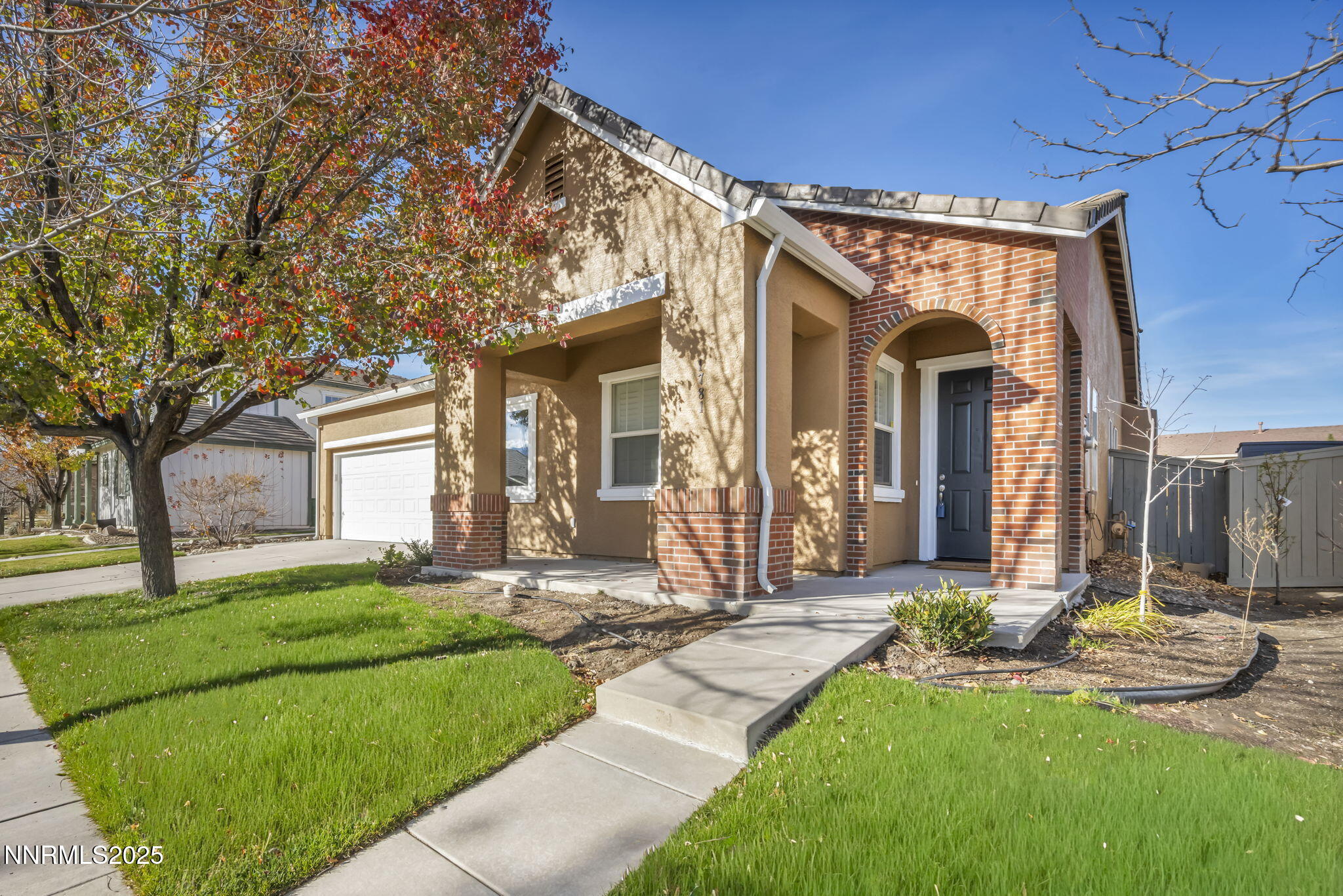 1781 Emerald Bay Drive Reno, NV 89521 - Photo 3 of 42 a front view of a house with garden