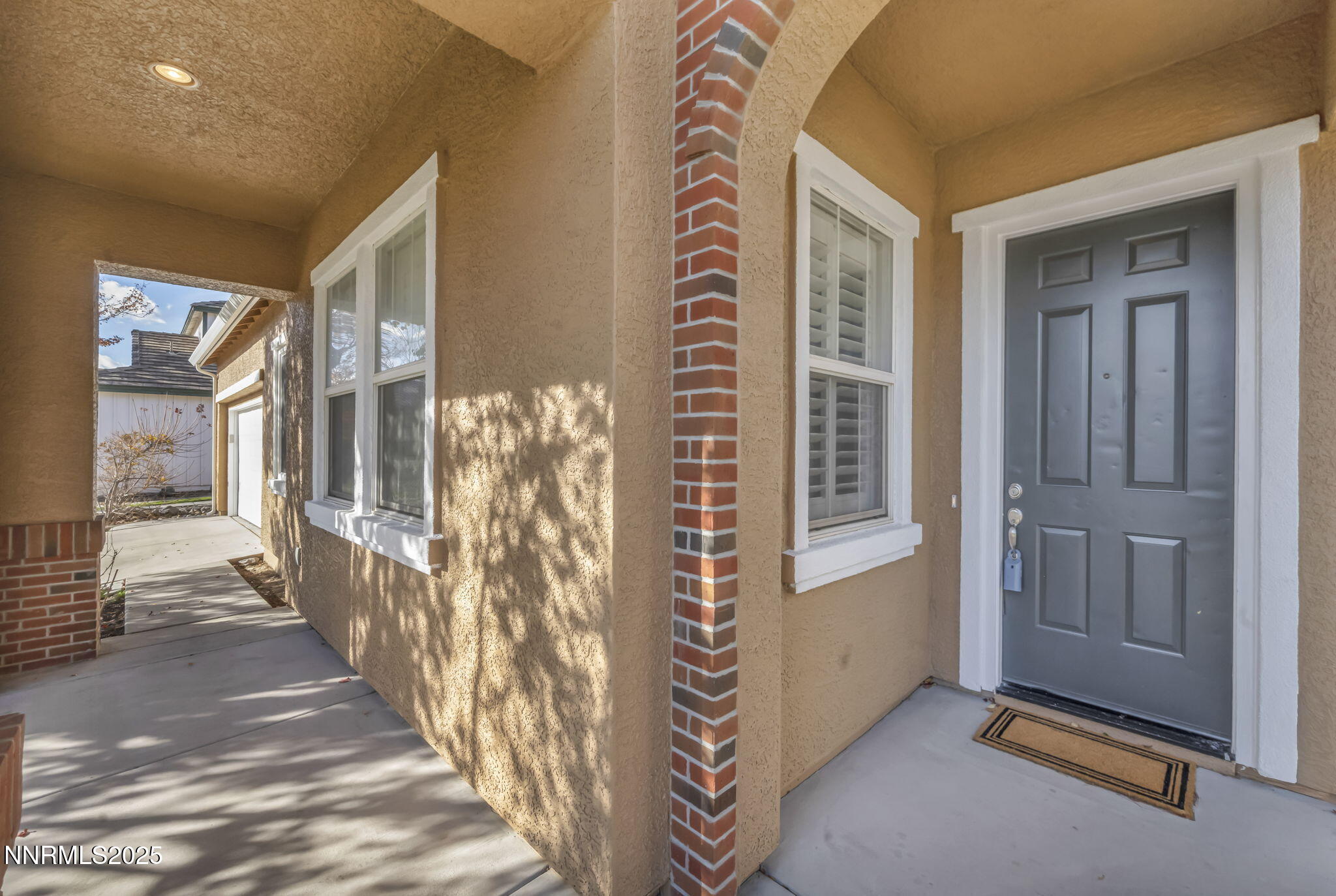 1781 Emerald Bay Drive Reno, NV 89521 - Photo 4 of 42 a view of a hallway with windows