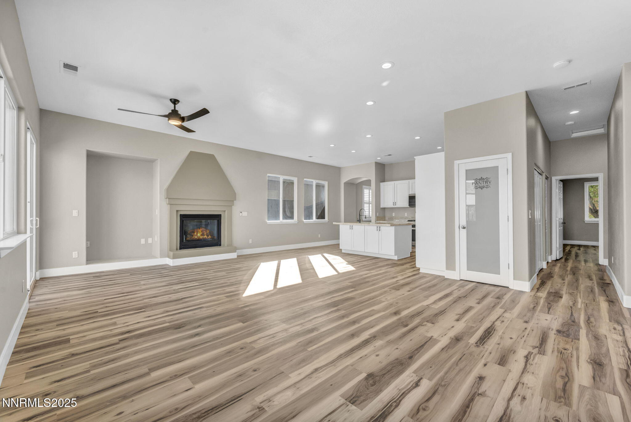 1781 Emerald Bay Drive Reno, NV 89521 - Photo 8 of 42 a view of empty room with wooden floor and fireplace