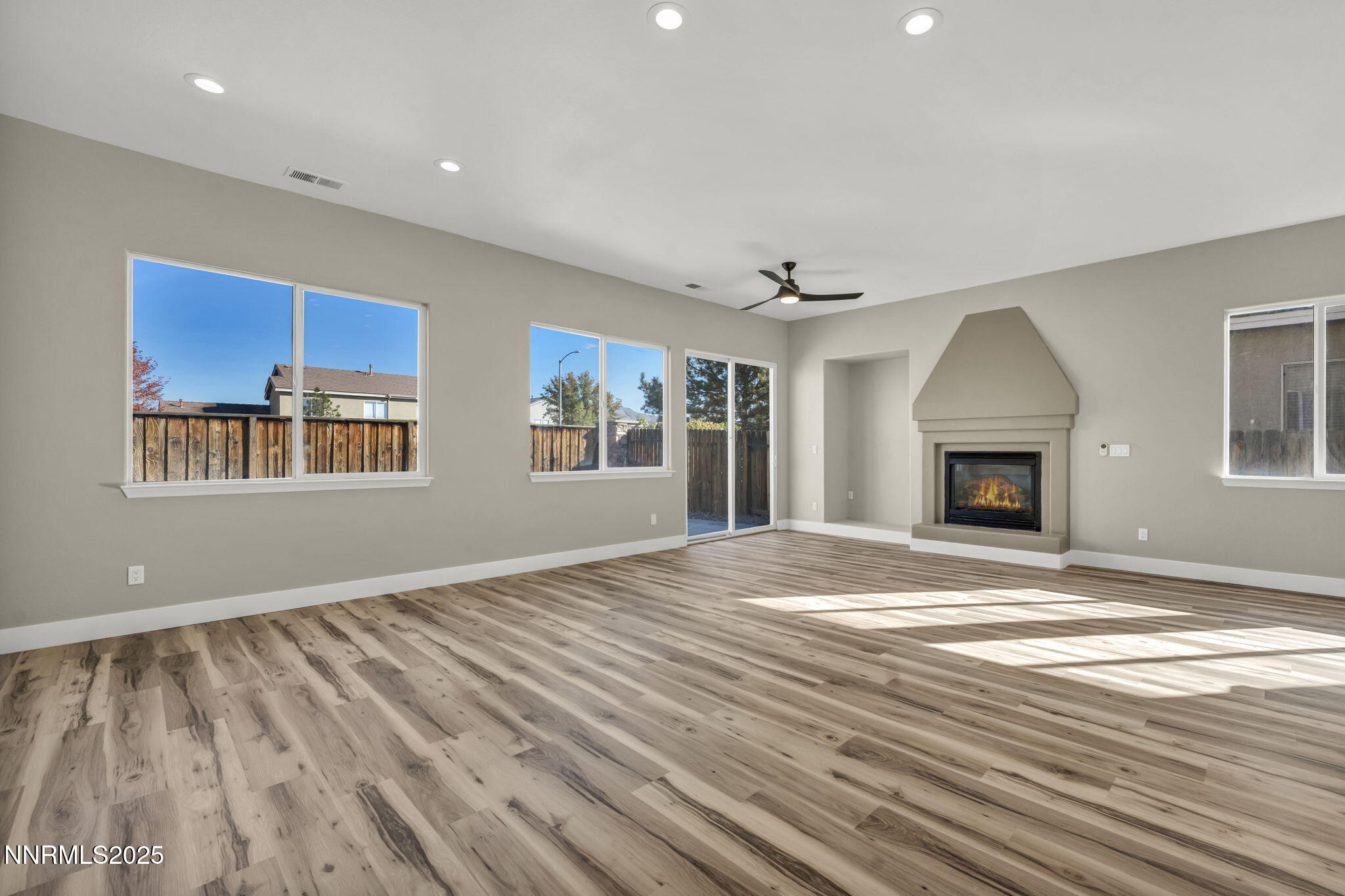 1781 Emerald Bay Drive Reno, NV 89521 - Photo 10 of 42 a view of an empty room with window and wooden floor