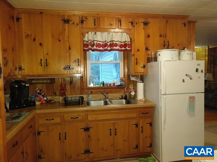 270 Elly Road Aroda, VA 22709 - Photo 6 of 17 a bathroom with a sink a refrigerator and a mirror