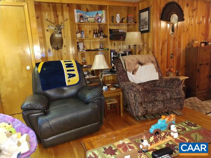 270 Elly Road Aroda, VA 22709 - Photo 8 of 17 a living room with a couch and a table