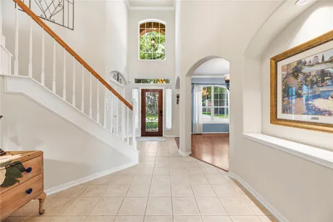 a view of an entryway with wooden floor
