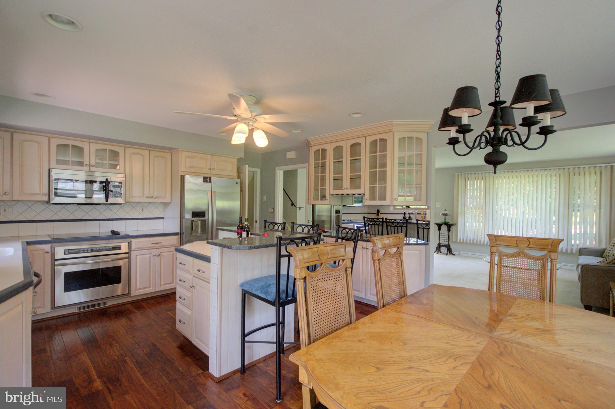 497 Falcon Road Wayne, PA 19087 - Photo 4 of 20 Open kitchen with hardwood flooring