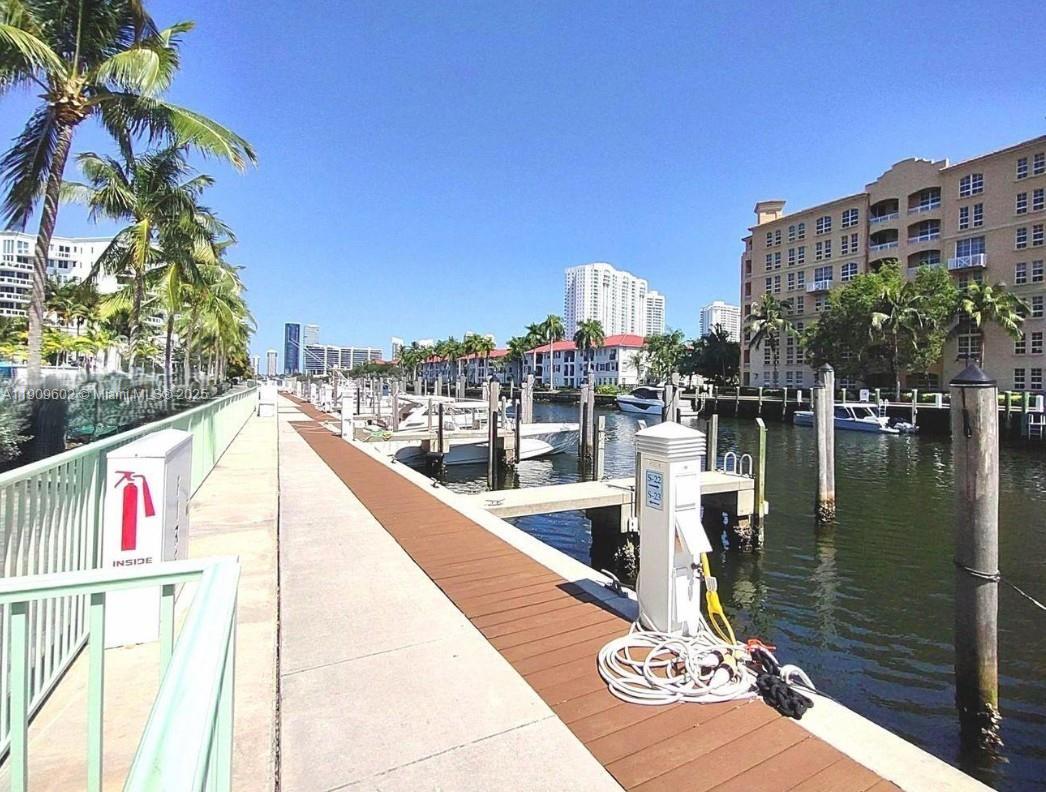 2950 Northeast 188th Street, Unit 501 Aventura, FL 33180 - Photo 14 of 46 a view of swimming pool from a balcony