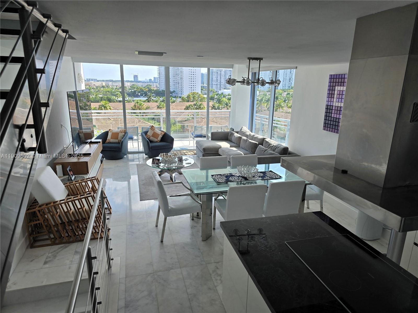 2950 Northeast 188th Street, Unit 501 Aventura, FL 33180 - Photo 18 of 46 a view of a dining room with furniture window and outside view