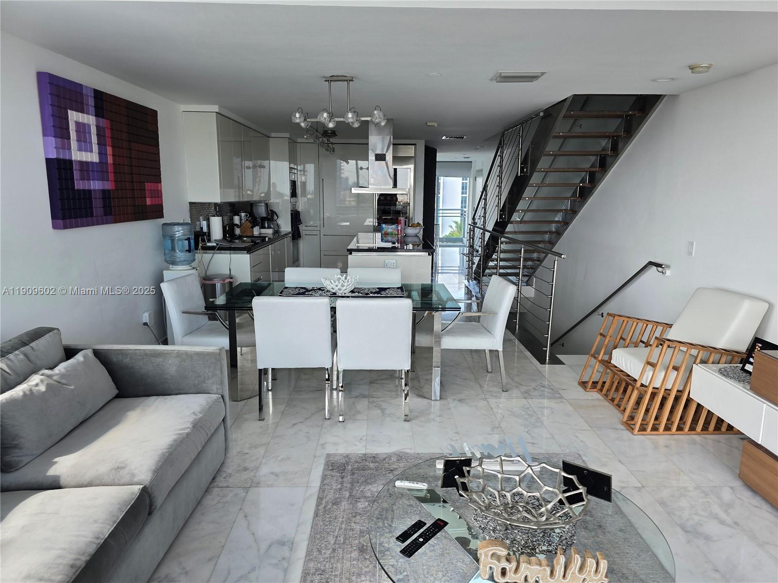 2950 Northeast 188th Street, Unit 501 Aventura, FL 33180 - Photo 20 of 46 a living room with furniture and wooden floor