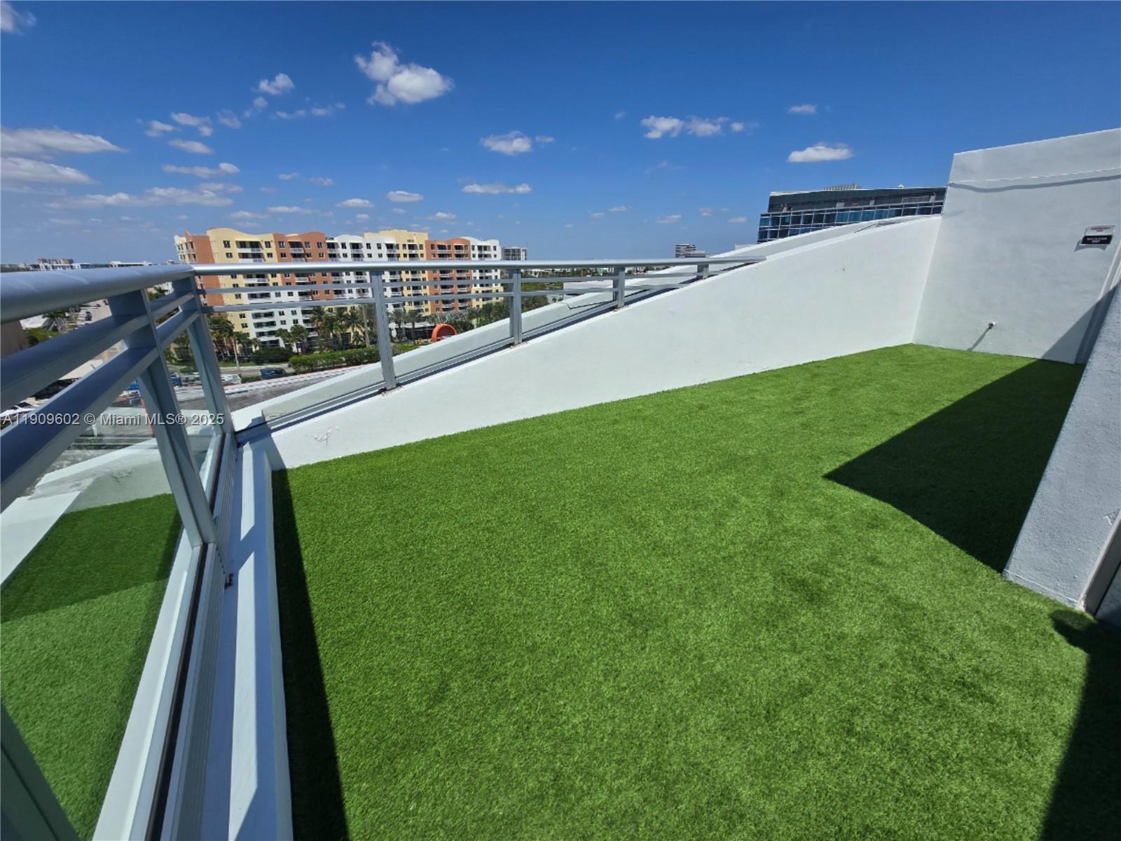 2950 Northeast 188th Street, Unit 501 Aventura, FL 33180 - Photo 38 of 46 a view of a green field