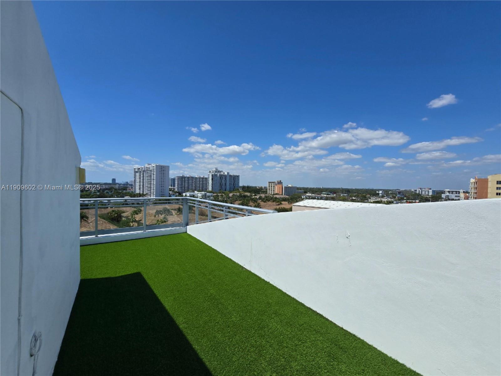 2950 Northeast 188th Street, Unit 501 Aventura, FL 33180 - Photo 39 of 46 a view of a swimming pool and a yard