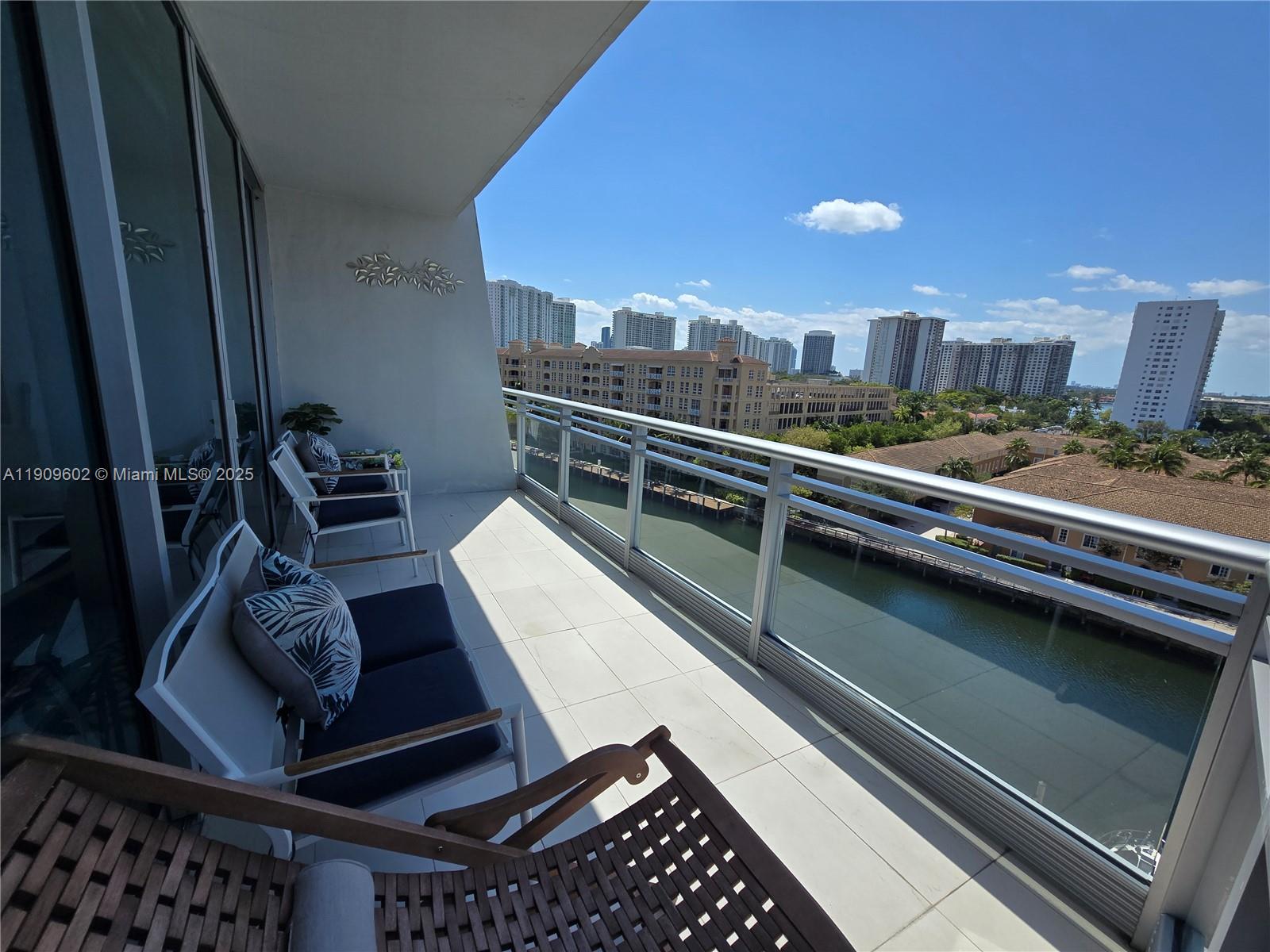 2950 Northeast 188th Street, Unit 501 Aventura, FL 33180 - Photo 44 of 46 a view of a balcony with chairs