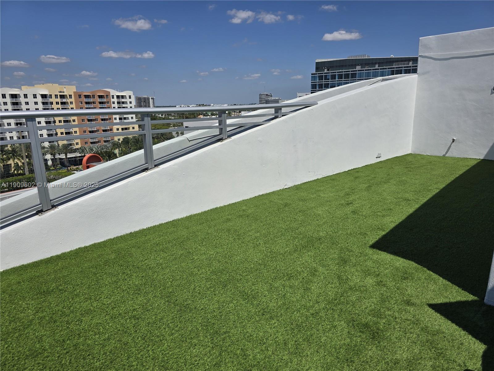 2950 Northeast 188th Street, Unit 501 Aventura, FL 33180 - Photo 6 of 46 a view of a big yard with an outdoor seating and yard