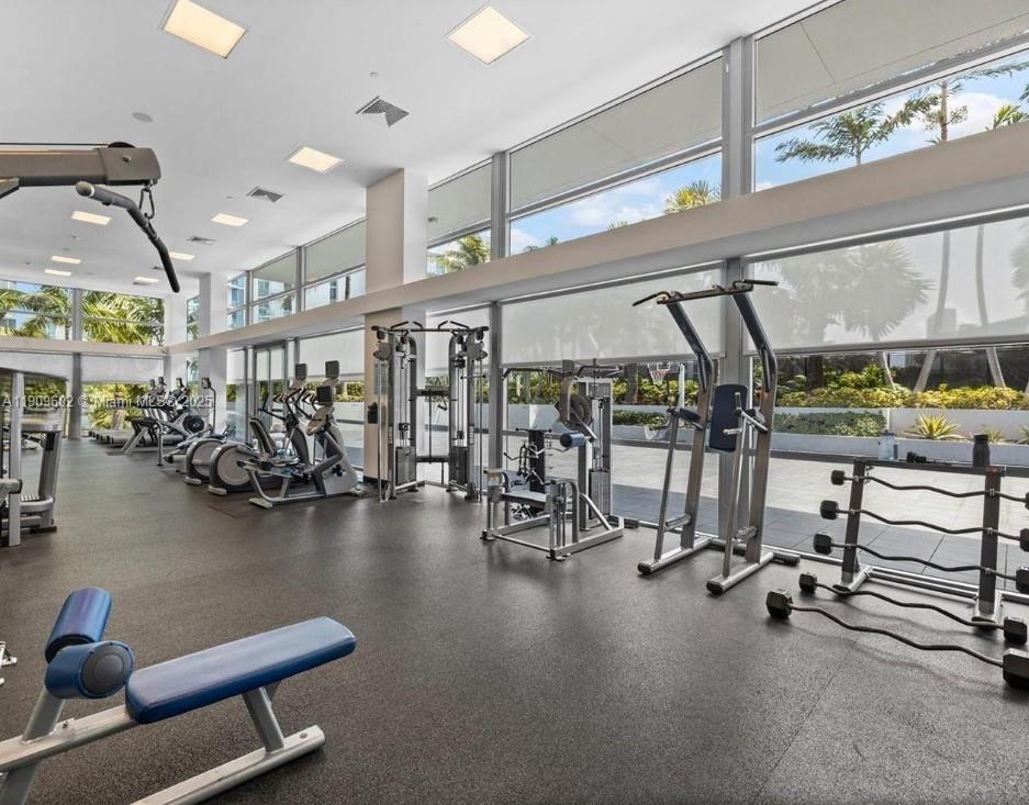 2950 Northeast 188th Street, Unit 501 Aventura, FL 33180 - Photo 8 of 46 a view of a room with gym equipment