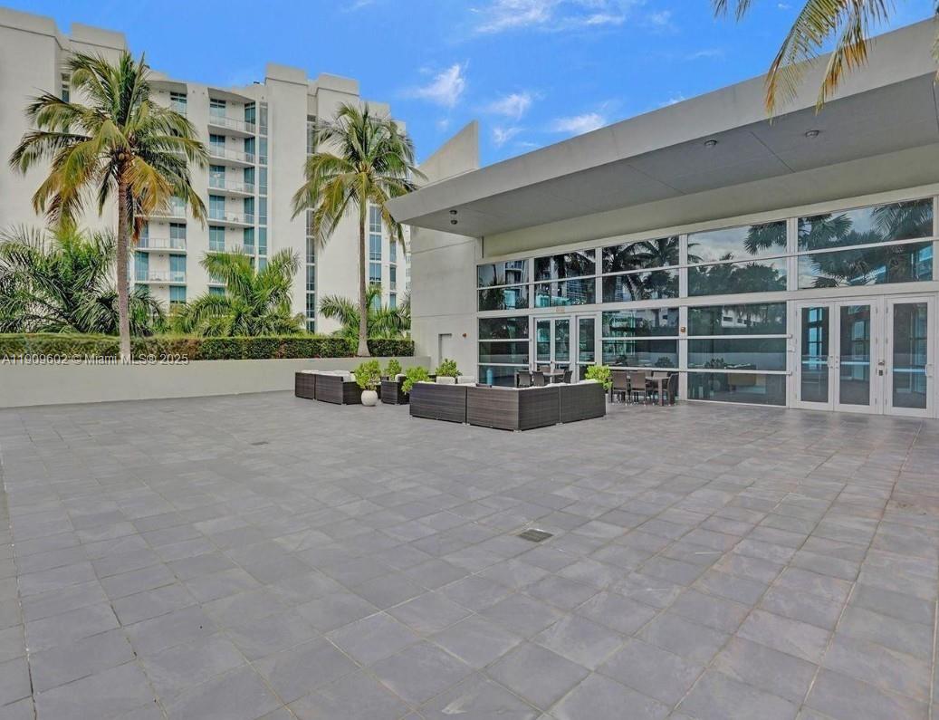 2950 Northeast 188th Street, Unit 501 Aventura, FL 33180 - Photo 10 of 46 front view of a building with a garden