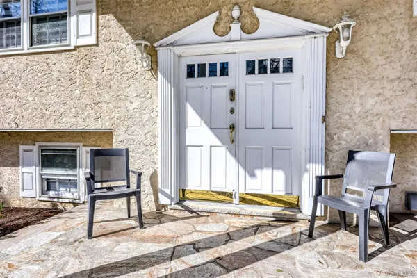 a view of front of house with outdoor seating