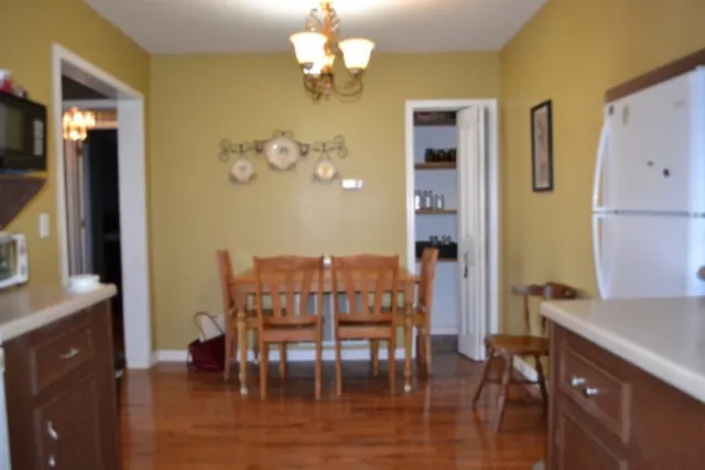 a kitchen with a sink a stove and cabinets