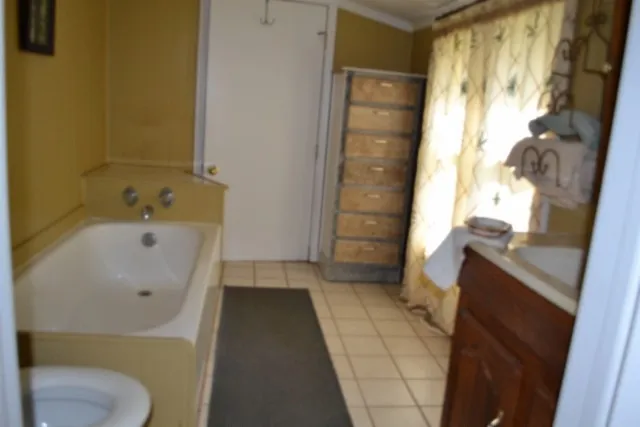 a bathroom with a bathtub and shower