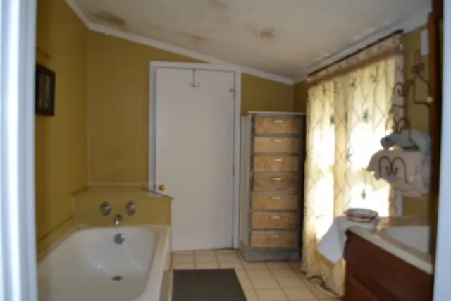 a view of a barn in the middle of a yard