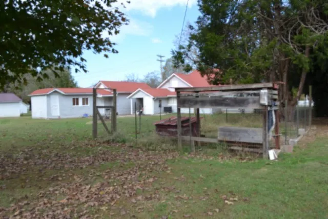 a house with trees in the background