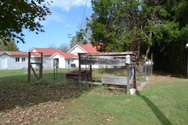 a view of a house with a tree