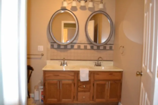 a bathroom with a sink and a mirror