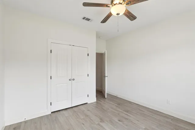 a view of an entryway with wooden floor