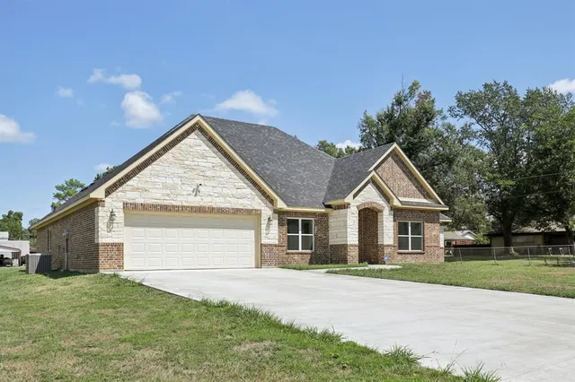 a view of house and outdoor space with yard