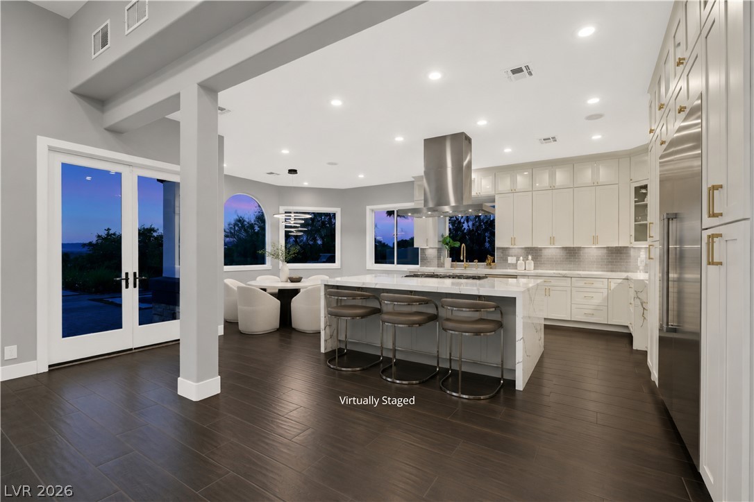 6 Rue Du Ville Henderson, NV 89011 - Photo 6 of 99 “Virtually Staged” This spacious kitchen and dining area features abundant natural light and modern amenities.