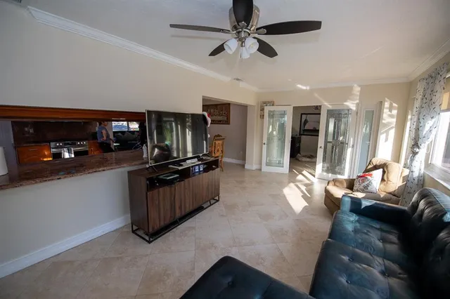 a kitchen with stainless steel appliances granite countertop a refrigerator stove and sink