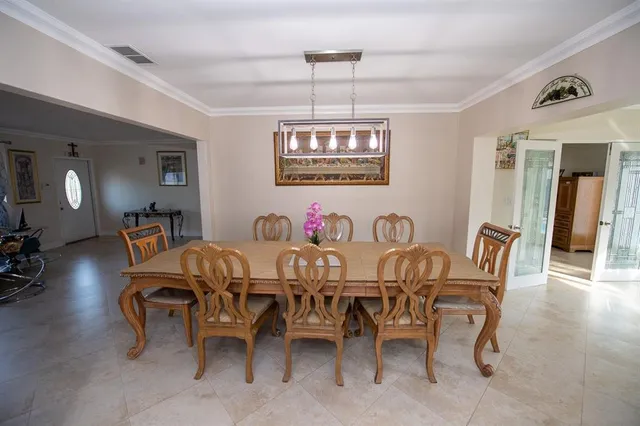 a kitchen with stainless steel appliances a stove a microwave and a refrigerator