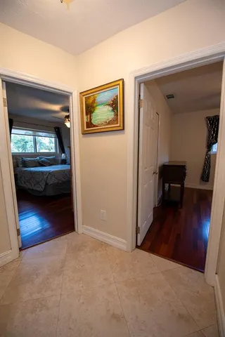 a bed room with a bed and a large mirror