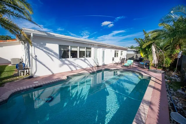 an outdoor sitting area with chairs