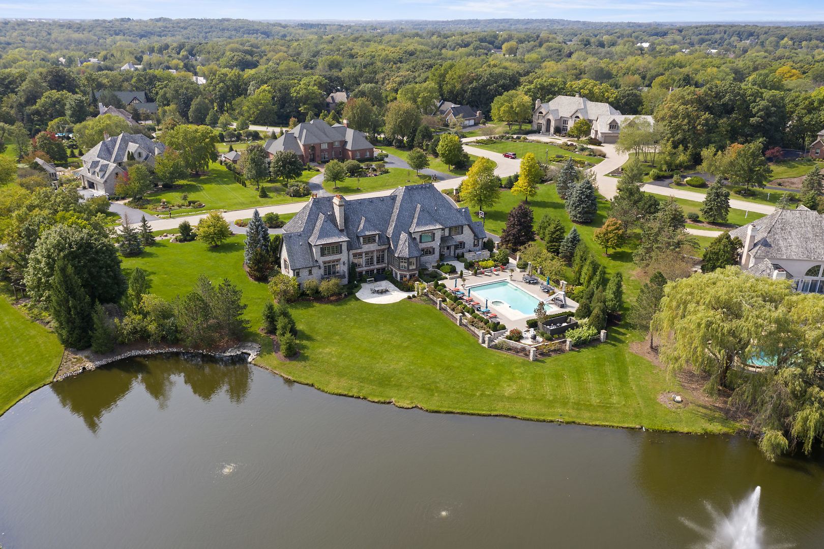 36W516 Hunters Gate Road St. Charles, IL 60175 - Photo 3 of 47 an aerial view of a house with a garden and lake view