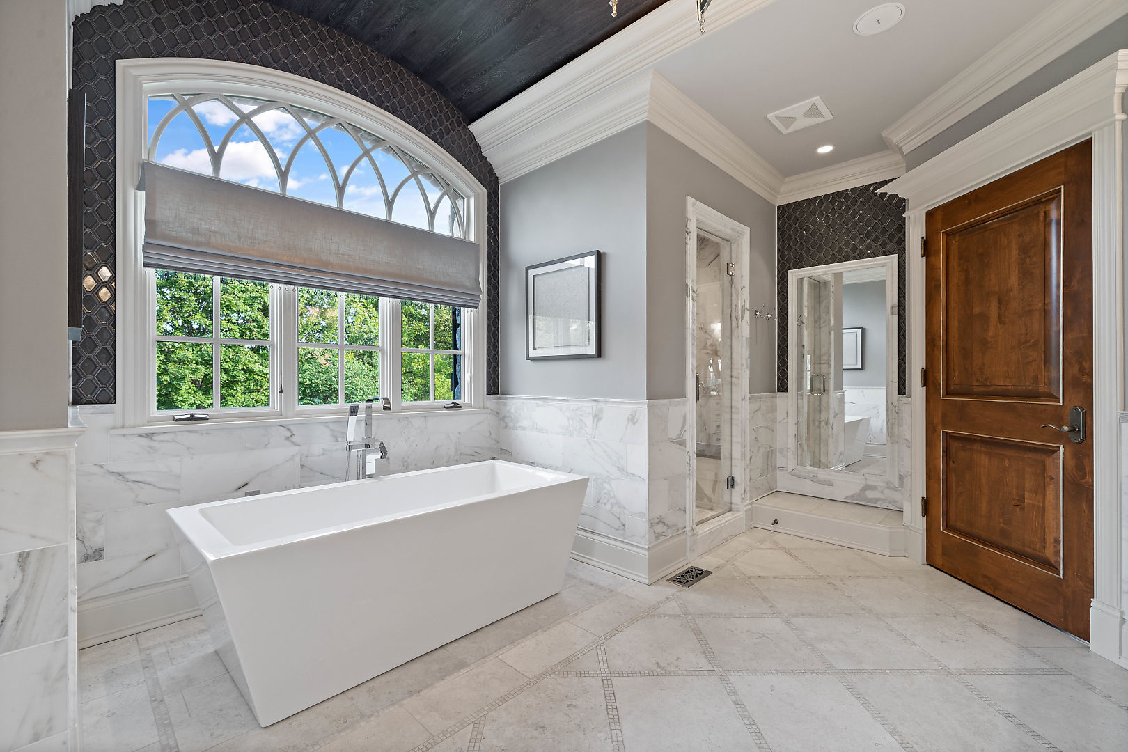 36W516 Hunters Gate Road St. Charles, IL 60175 - Photo 25 of 47 a spacious bathroom with a tub shower and windows
