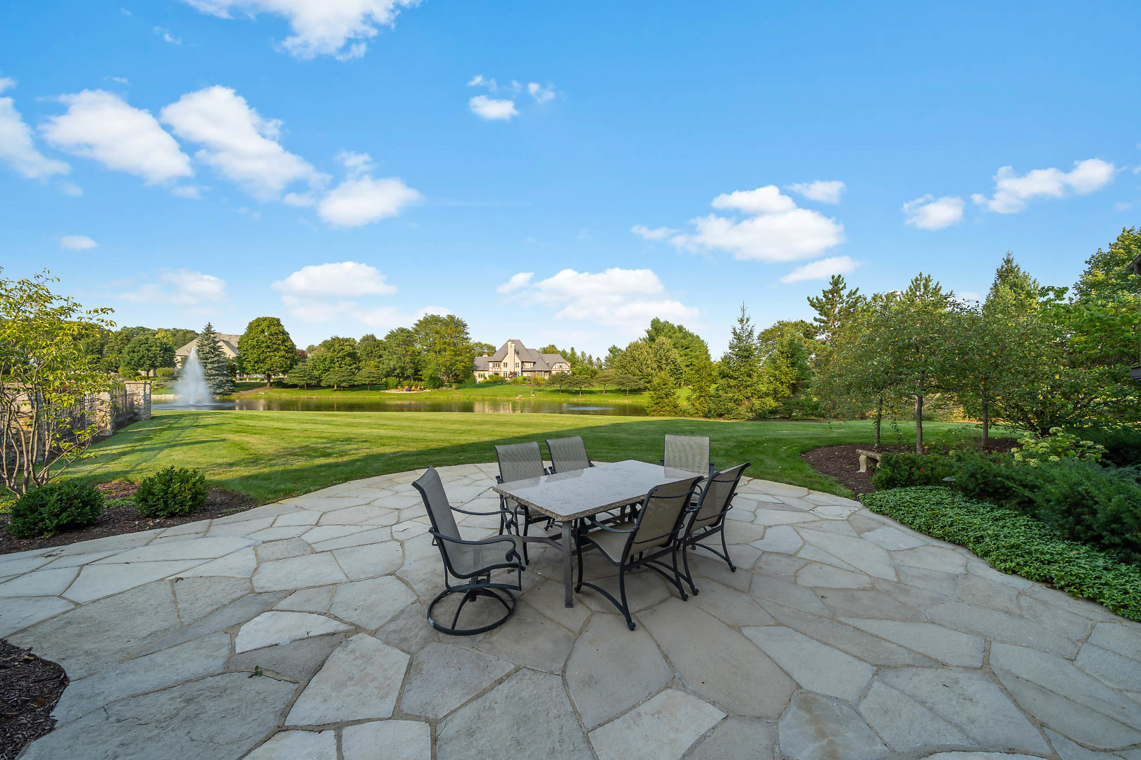 36W516 Hunters Gate Road St. Charles, IL 60175 - Photo 45 of 47 a view of a chairs and table in patio with a lake view