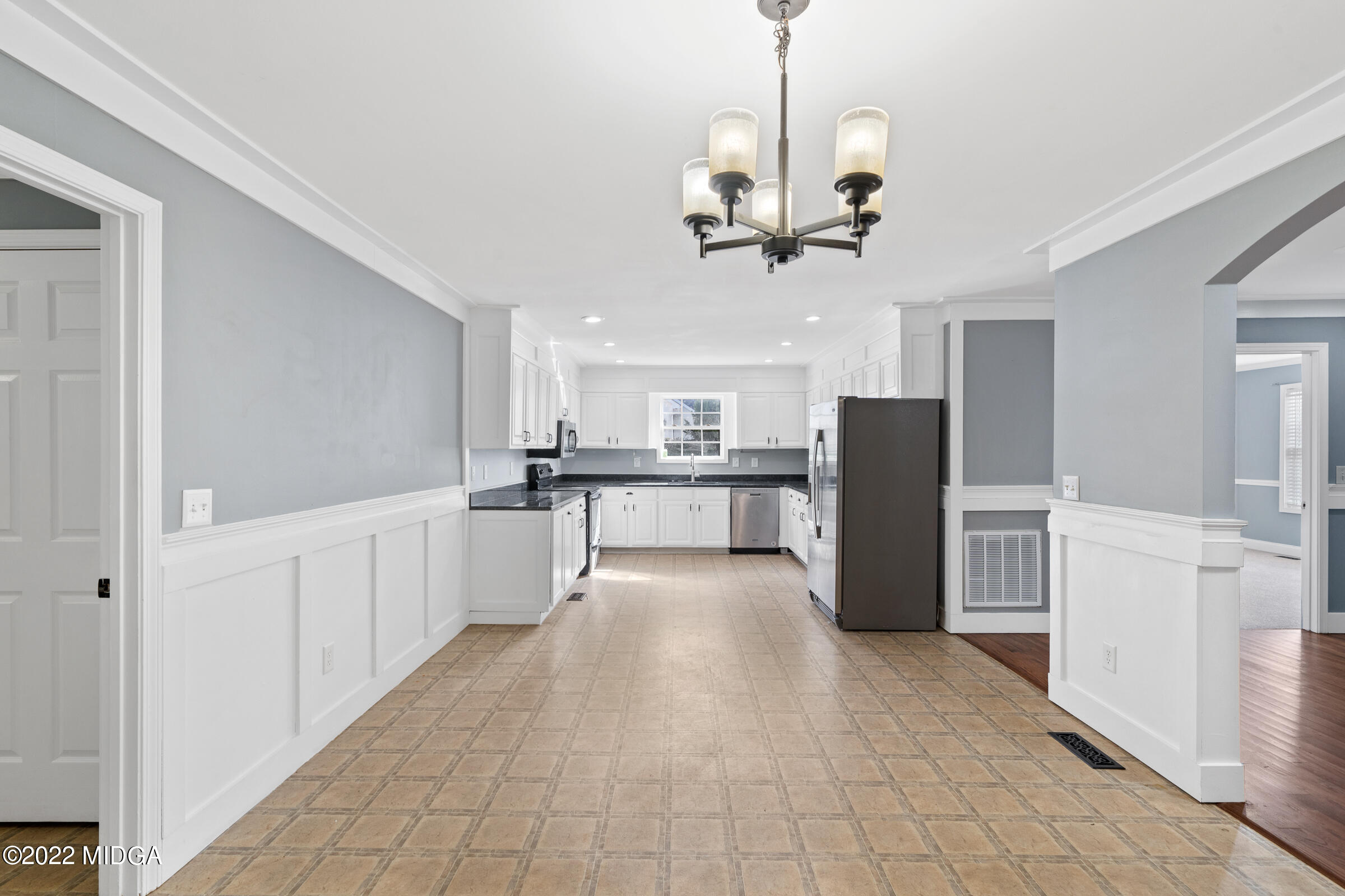 245 Lite-N-Tie Road Gray, GA 31032 - Photo 12 of 29 a view of a kitchen with refrigerator and microwave