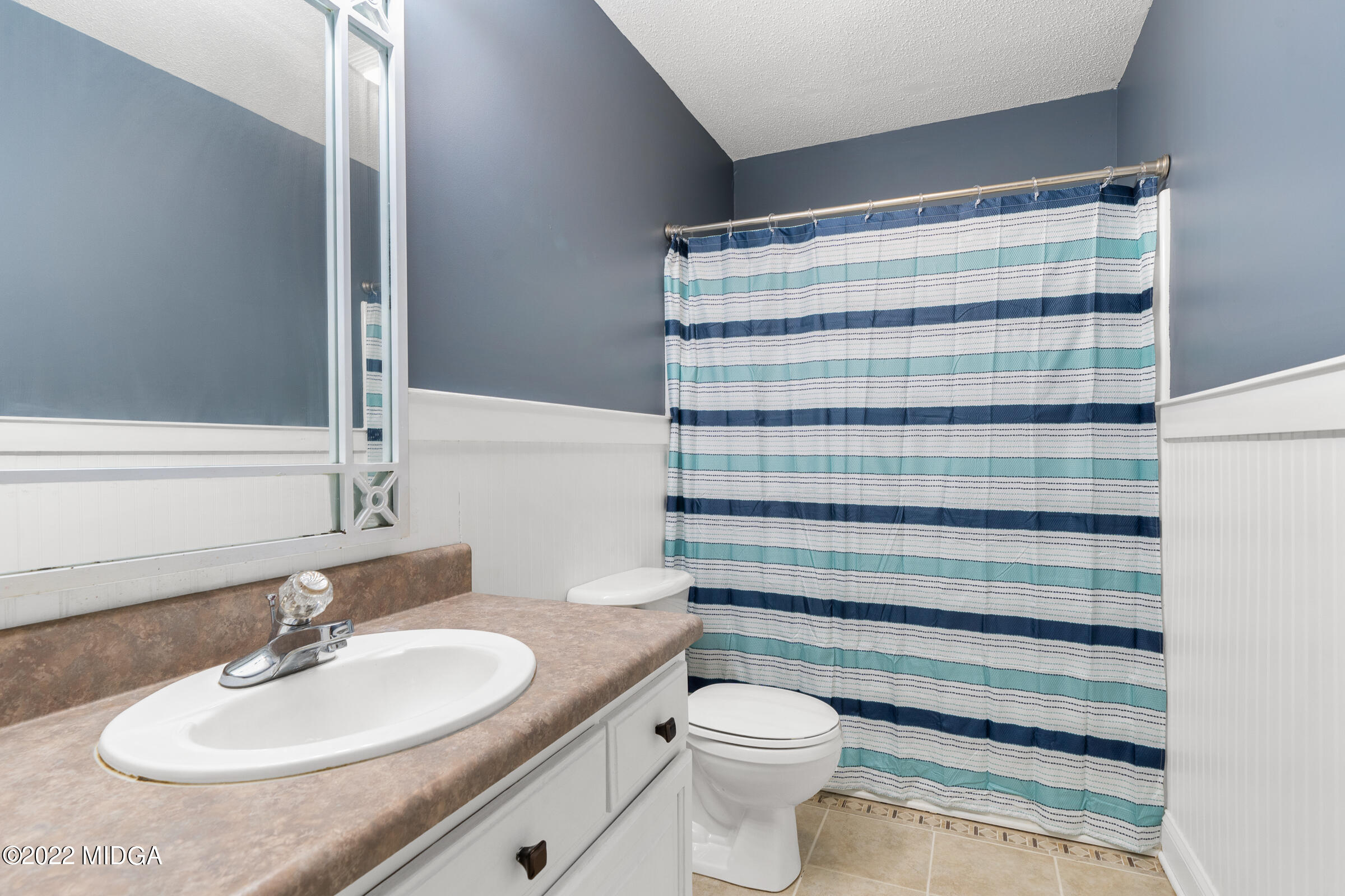 245 Lite-N-Tie Road Gray, GA 31032 - Photo 20 of 29 a bathroom with a sink toilet and shower