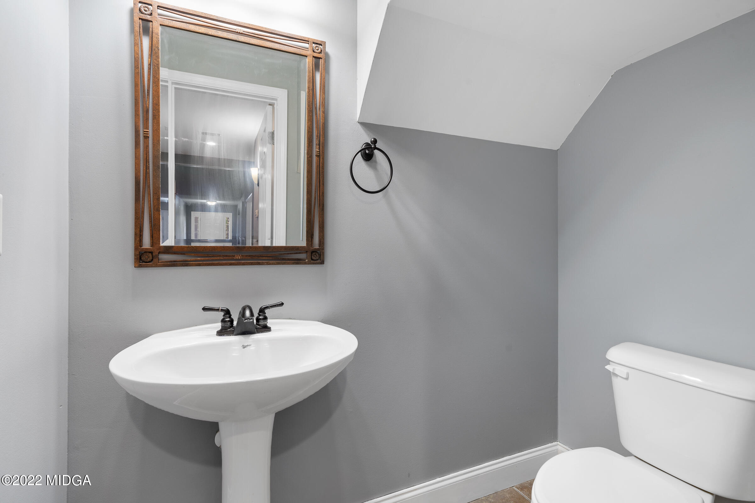 245 Lite-N-Tie Road Gray, GA 31032 - Photo 22 of 29 a bathroom with a toilet sink and mirror