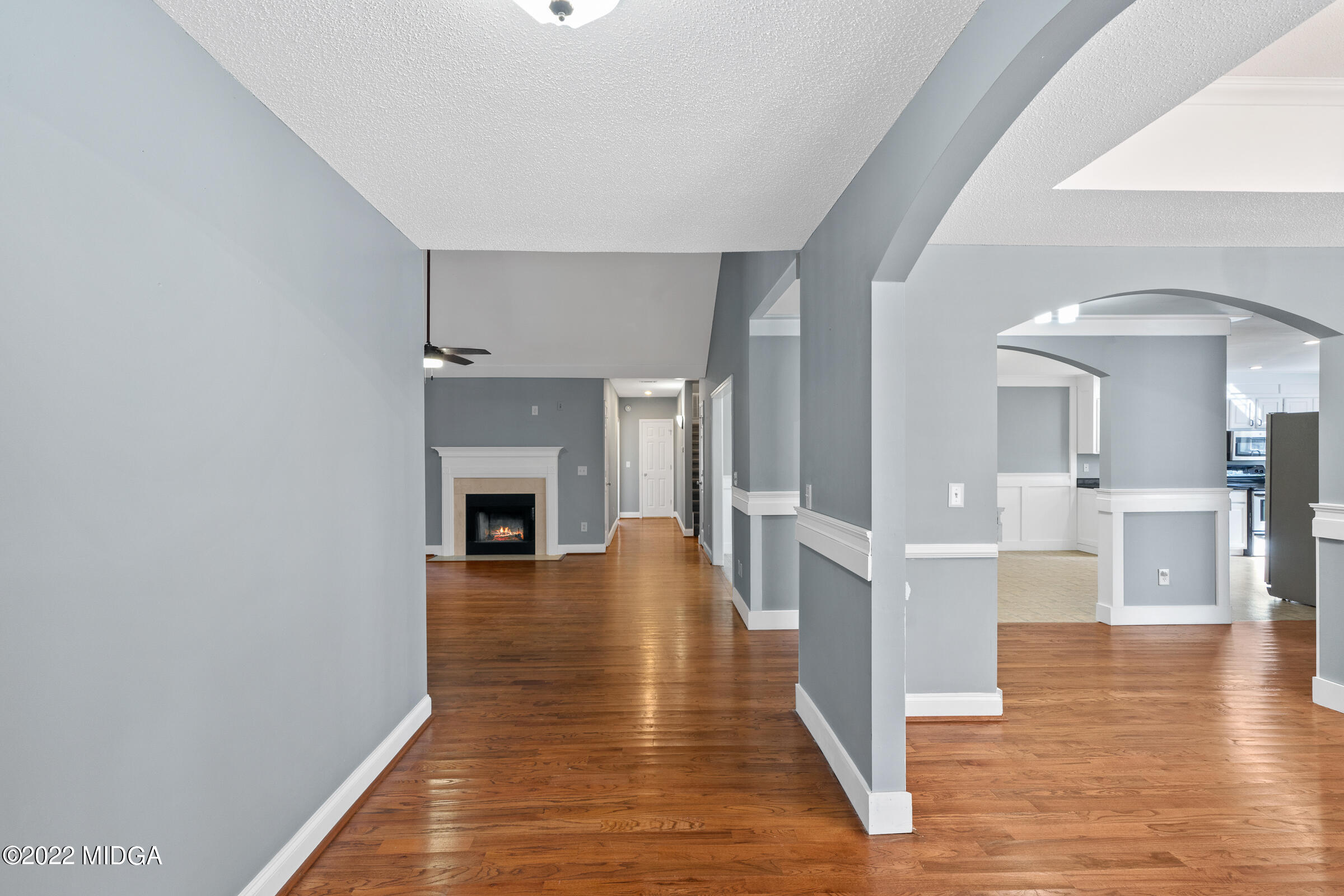 245 Lite-N-Tie Road Gray, GA 31032 - Photo 6 of 29 a view of a living room with wooden floor and a fireplace