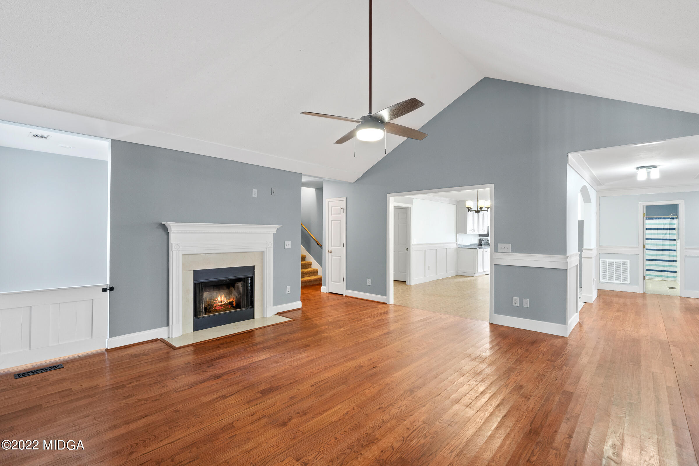245 Lite-N-Tie Road Gray, GA 31032 - Photo 8 of 29 a view of an empty room with wooden floor fireplace and a window